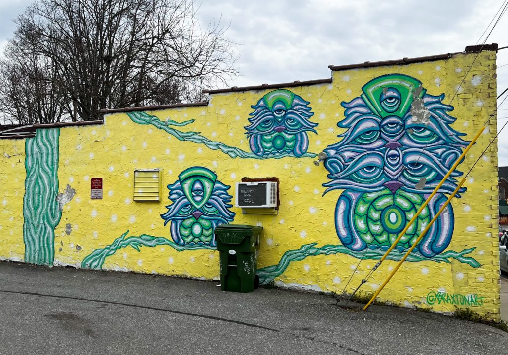 A yellow, green, and blue mural.